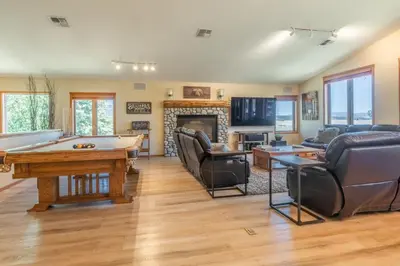 a living room with a pool table and a couch at Snowcreek 821 in Mammoth Lakes