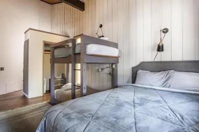 a bedroom with two bunk beds in a room at Sierra Park Villas 45 in Mammoth Lakes