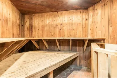 a wooden sauna with a bench in it at Sierra Park Villas 45 in Mammoth Lakes