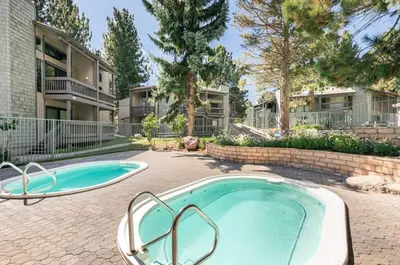 a swimming pool in a yard with a building at Sierra Park Villas 45 in Mammoth Lakes
