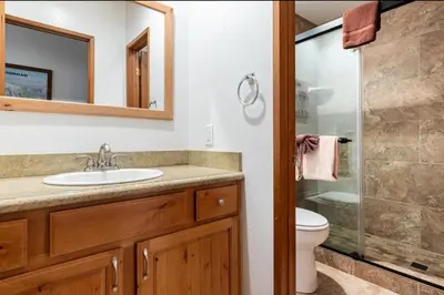a bathroom with a sink and a toilet and a shower at Val DIsere 14 in Mammoth Lakes