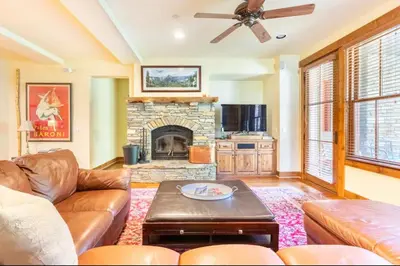a living room with a couch and a fireplace at Lodges 1129 in Mammoth Lakes