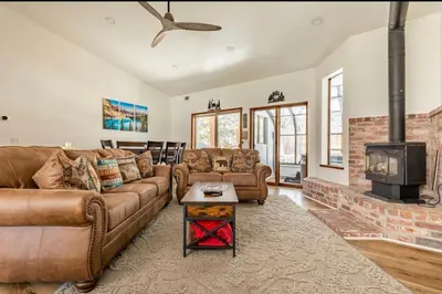 a living room with a couch and a fireplace at Forest Creek 21 in Mammoth Lakes
