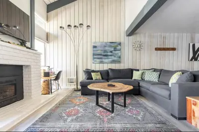 a living room with a couch and a coffee table at Chamonix 91 in Mammoth Lakes