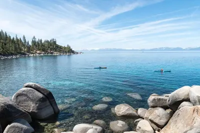 two people in boats on a large body of water at Everline Resort & Spa 534 in Olympic Valley