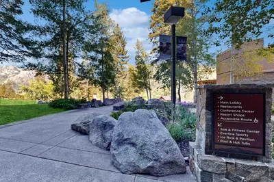 a sign in a park next to some rocks at Everline Resort & Spa 534 & 536 in Olympic Valley
