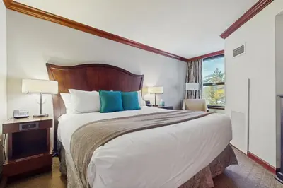 a hotel room with a large bed and a window at Everline Resort & Spa 534 & 536 in Olympic Valley