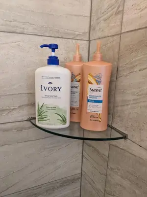 a shelf with four bottles of soap and shampoo at 717 Charming 4 Bed Mid-Town Retreat in Reno