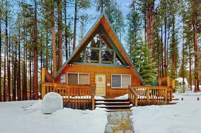 a small cabin in the woods in the snow at Cabin on Ralph in South Lake Tahoe