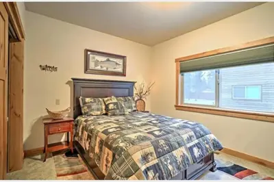 a bedroom with a bed and a window at The Salty Pine - Pool Table, Small Dogs, 4 Bedrms in South Lake Tahoe