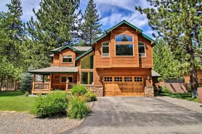 a wooden house with a driveway in front of it at The Salty Pine - Pool Table, Small Dogs, 4 Bedrms in South Lake Tahoe