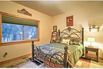 a bedroom with a bed and a window at The Salty Pine - Pool Table, Small Dogs, 4 Bedrms in South Lake Tahoe