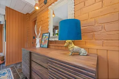 a blue lamp sitting on top of a dresser at 16 mi to Yosemite-1 mi to Oakhurst-Anthro Decor in Oakhurst