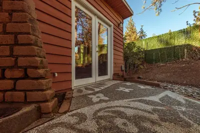 a front door of a house with a mosaic floor at 16 mi to Yosemite - Rustic Studio - Hiking Nearby in Oakhurst