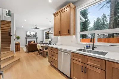 a kitchen with a sink and a large window at Tahoe Toasty - 3 Bedroom Home Near Sledding Hill in South Lake Tahoe
