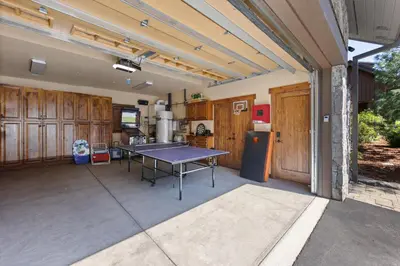 a patio with a ping pong table on it at 2 Luxury Adjacent Northstar Homes Walk to Lifts Private Hot Tubs in Truckee