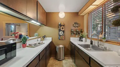 a kitchen with a sink and a window at Unique Northstar Cabin w Fireplace Minutes to Skiing Trails and Town Alpine Bend by AvantStay in Truckee