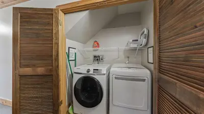 a washer and dryer in a small room at Unique Northstar Cabin w Fireplace Minutes to Skiing Trails and Town Alpine Bend by AvantStay in Truckee