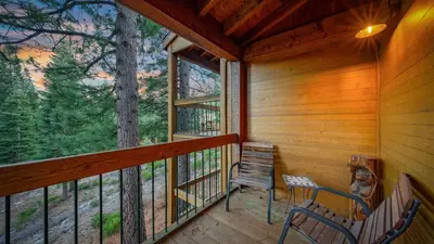 a screened in porch with two chairs and a window at Unique Northstar Cabin w Fireplace Minutes to Skiing Trails and Town Alpine Bend by AvantStay in Truckee