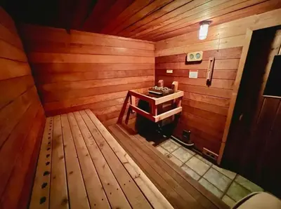 an empty room with a sink in a wooden room at Stylish Mammoth 1BR & Loft With Fireplace in Mammoth Lakes