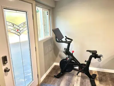 a room with a gym with a treadmill and a window at Private Home,Ski HotTub,Firepit,Apple Hill,Tahoe in Placerville