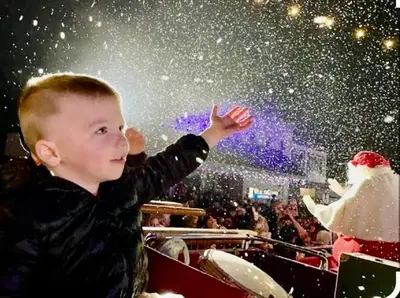 a young boy is waving at the snow at Private Home,Ski HotTub,Firepit,Apple Hill,Tahoe in Placerville