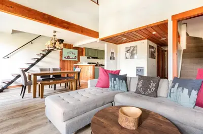a living room with a couch and a table at Val DIsere 27 in Mammoth Lakes