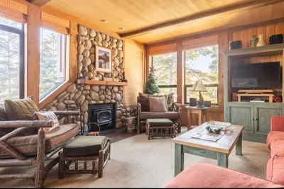 a living room filled with furniture and a fireplace at Treehouse at Canyon Lodge Walk to Slopes in Mammoth Lakes