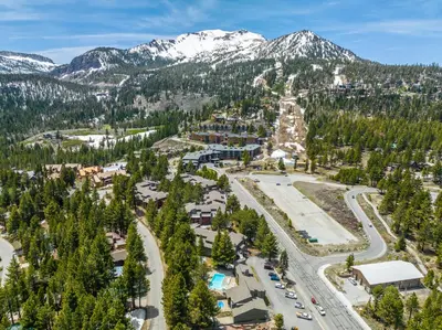 an aerial view of a resort with mountains at Summit 107 in Mammoth Lakes