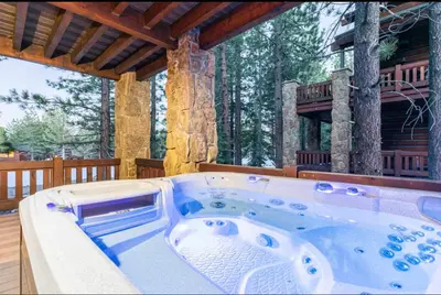 a jacuzzi tub on the deck of a cabin at Stonegate 12 in Mammoth Lakes