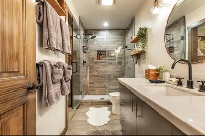 a bathroom with a shower and a sink and a toilet at Hidden Valley 33 in Mammoth Lakes