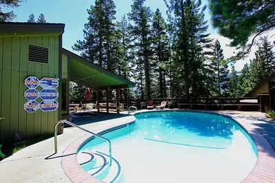a large swimming pool next to a building at Hidden Valley 33 in Mammoth Lakes