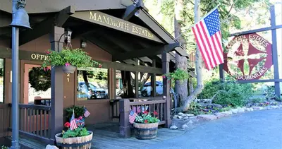 a restaurant with an american flag in front of it at Mammoth Estates 233 in Mammoth Lakes