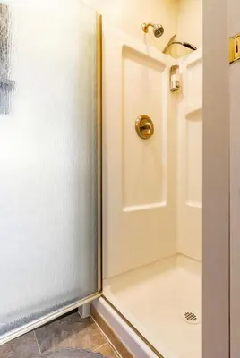 a shower with a glass door in a bathroom at Seasons Four 110 in Mammoth Lakes