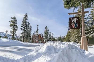a pile of snow next to a sign in the snow at Seasons Four 110 in Mammoth Lakes