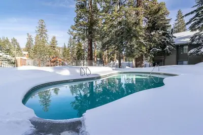 a swimming pool covered in snow at Seasons Four 110 in Mammoth Lakes