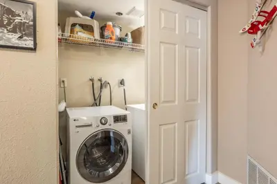 a laundry room with a washer and dryer at Silver Bear 32 in Mammoth Lakes