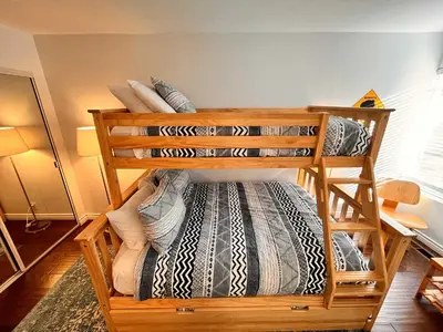 a couple of bunk beds in a room at Cozy Mammoth Ski Condo with Mtn Views and Hot Tub in Mammoth Lakes