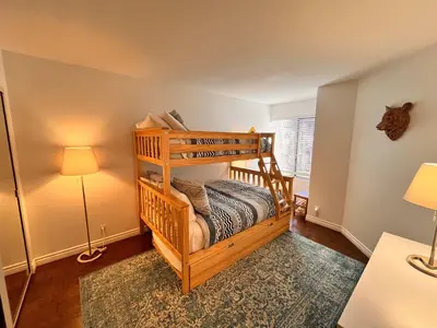 a bedroom with a bunk bed in a room at Cozy Mammoth Ski Condo with Mtn Views and Hot Tub in Mammoth Lakes