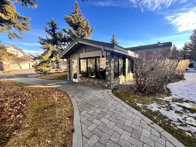 a house with a stone walkway in front of it at Cozy Mammoth Ski Condo with Mtn Views and Hot Tub in Mammoth Lakes