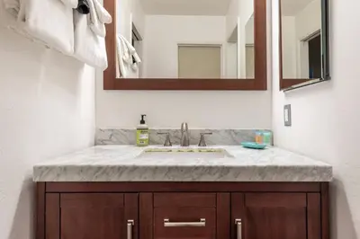 a bathroom with a sink and a mirror at Chateau Blanc 21 in Mammoth Lakes