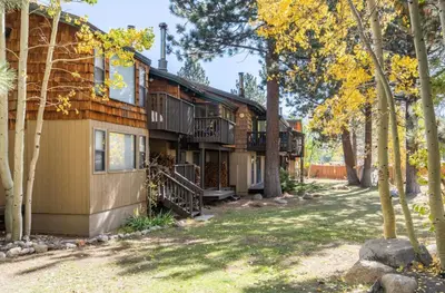 a house with a yard in front of it at Chateau Blanc 21 in Mammoth Lakes
