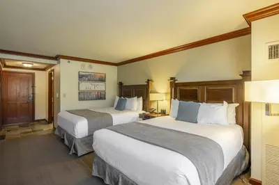 a hotel room with two beds in a room at Ski-InandSki-Out! 2BR Condo with Resort Pools, Spa in Olympic Valley