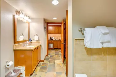a bathroom with a sink and a shower at Ski-InandSki-Out! 2BR Resort Condo with Pool, Hot Tub in Olympic Valley