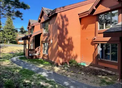 a house with its shadows on the side of it at Snowcreek 1 in Mammoth Lakes