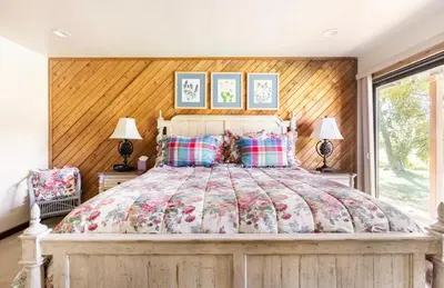 a bedroom with a large bed with two lamps at Snowcreek 222 in Mammoth Lakes