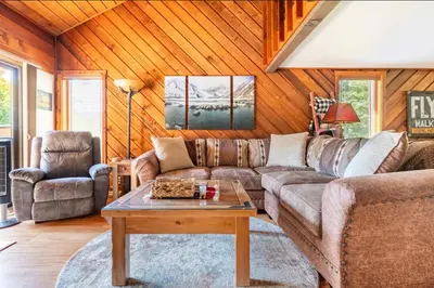 a living room with a couch and a table at Snowcreek 315 in Mammoth Lakes