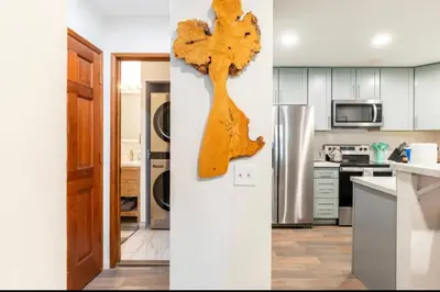 a kitchen with a wooden tree on the wall at St. Moritz 39 in Mammoth Lakes