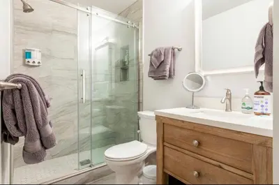 a bathroom with a shower and a toilet and a sink at St. Moritz 39 in Mammoth Lakes