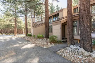 a house with trees in front of it at St. Moritz 39 in Mammoth Lakes